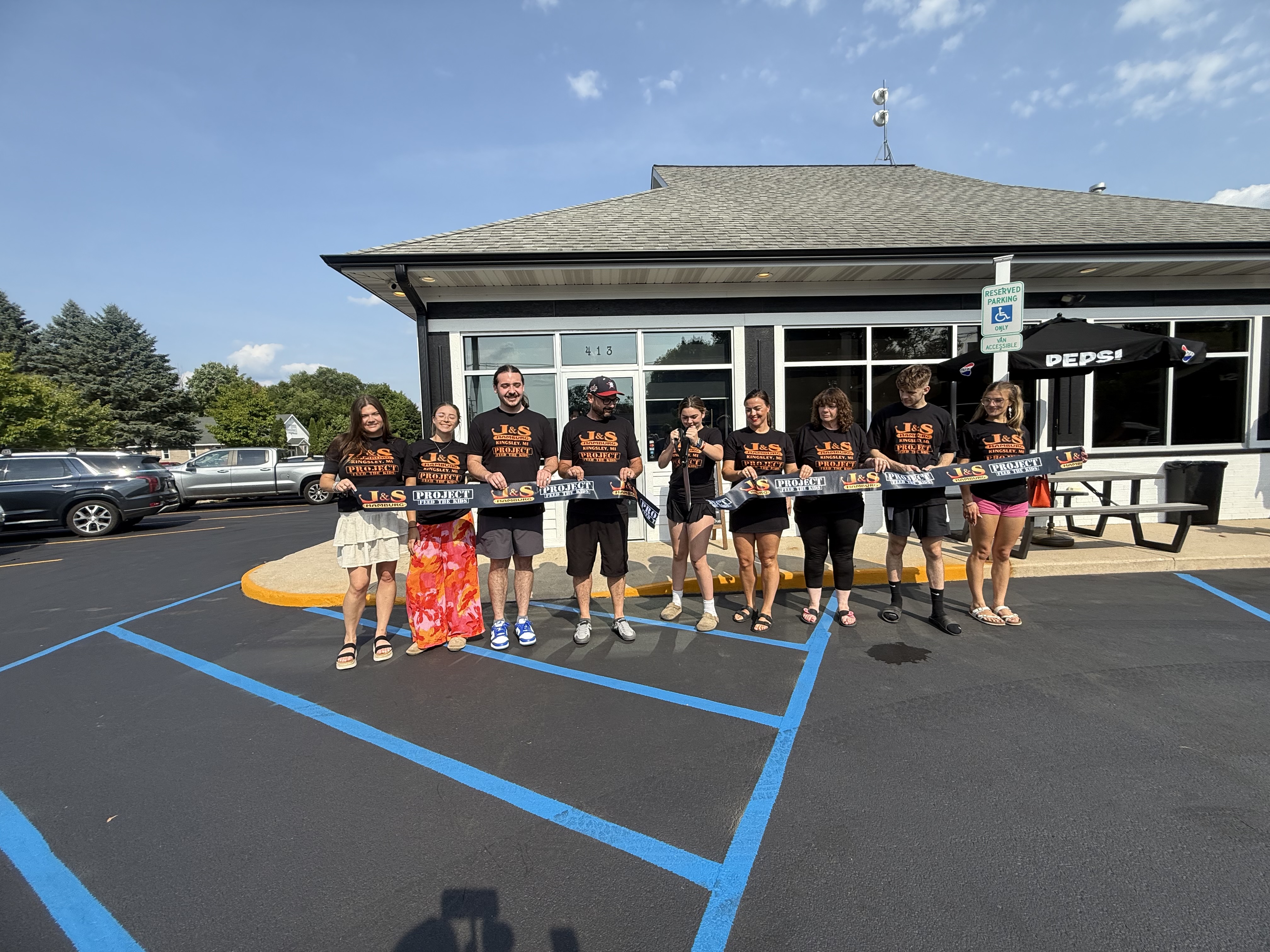 J&S Kingsley team ribbon cutting at 413 W. Main St
